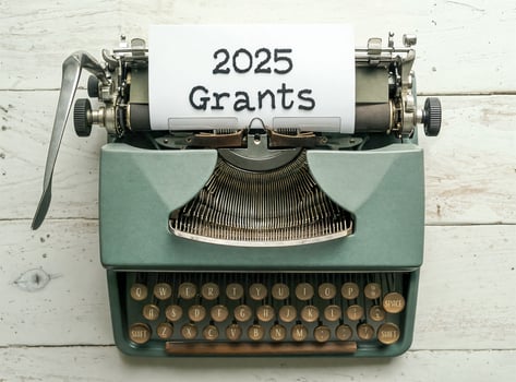 vintage typewriter with 2025 grants announcement photo