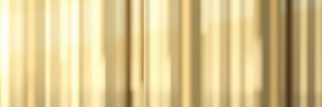 Vibrant backdrop with golden curtains in a lively indoor setting during a festive event photo