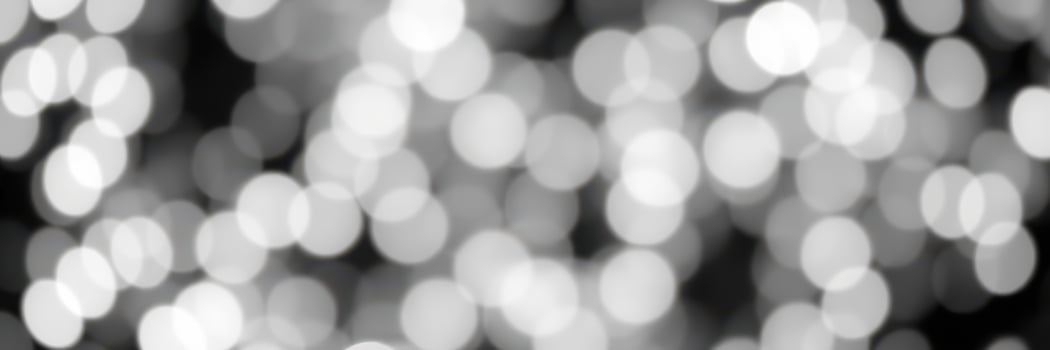 Soft bokeh lights create a dreamy atmosphere at night during a festive celebration in a city setting photo