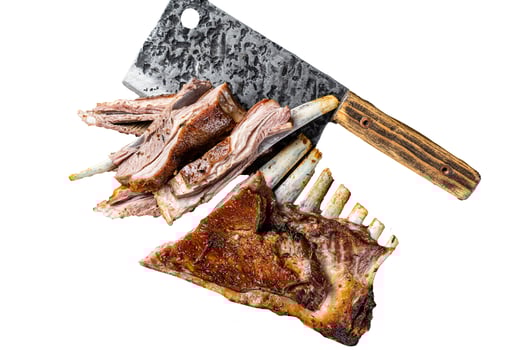 Roast lamb ribs, mutton spareribs, sliced meat on wooden board. Isolated, white background. photo