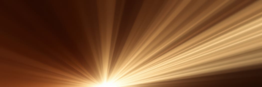 Warm golden rays illuminate a tranquil space during a morning sunrise photo