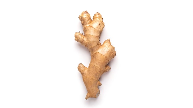 Ginger root in isolated white background. Fresh vegetable photo