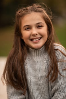 Portrait of a happy child girl looking at camera and smiling. photo