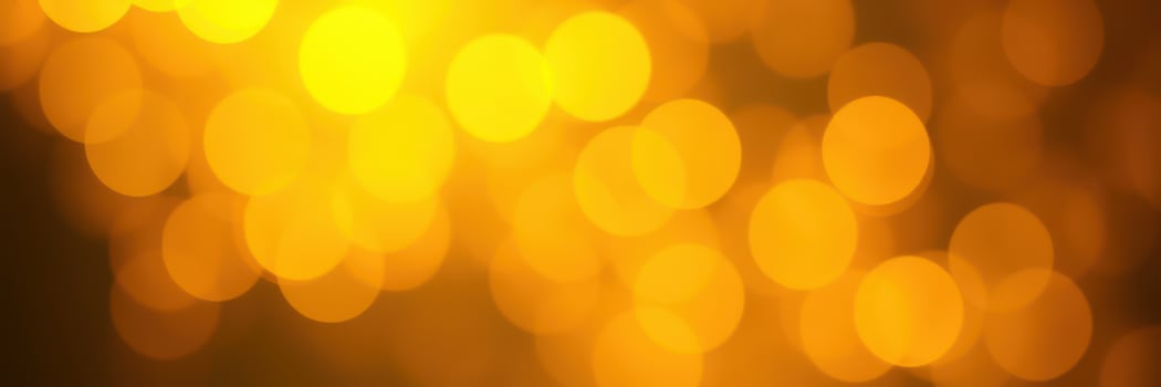 Bright golden bokeh lights create a warm and festive atmosphere for celebrations and gatherings in the evening photo