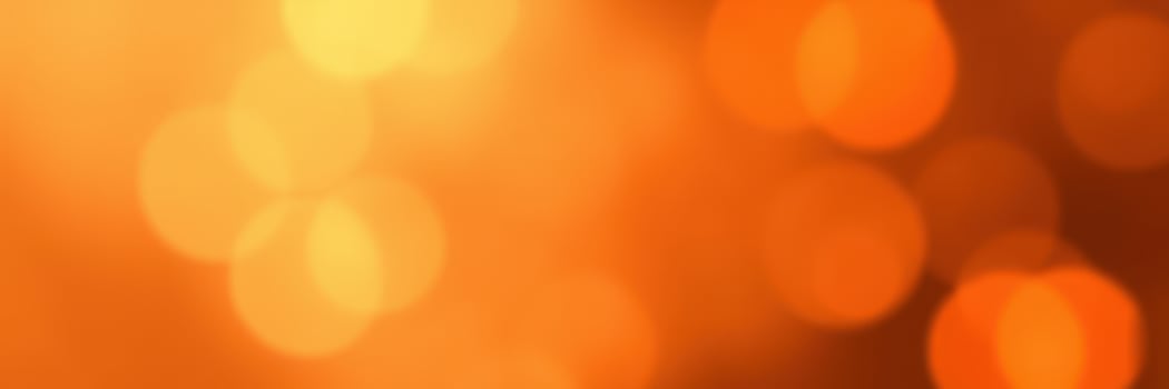 Warm golden bokeh lights create a cozy atmosphere during a sunset or evening event photo