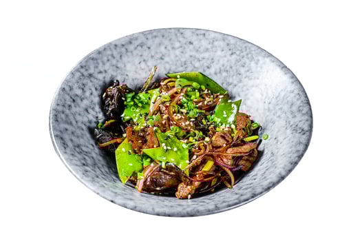 Wok. Soba stir fry noodles with beef and vegetables Isolated on white background. Top view. photo
