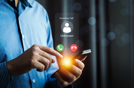 Close Up of a Man Receiving an Incoming Call from an Unknown Number on a Smartphone with Bright Notification Icons, Highlighting Communication, Technology, and Privacy Concerns photo