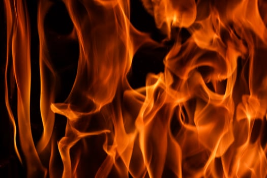 Flames of fire on a black background. The mystery of fire. photo
