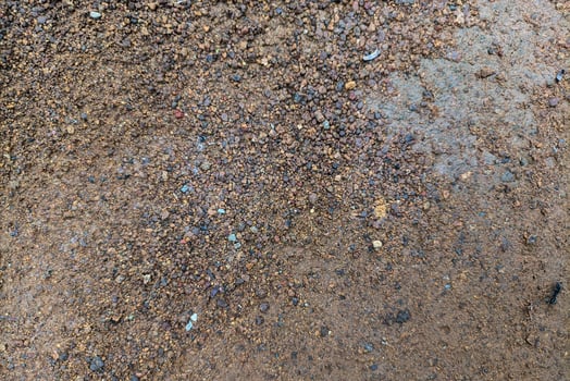 Close Up Of Textured Brown Gravel Ground photo