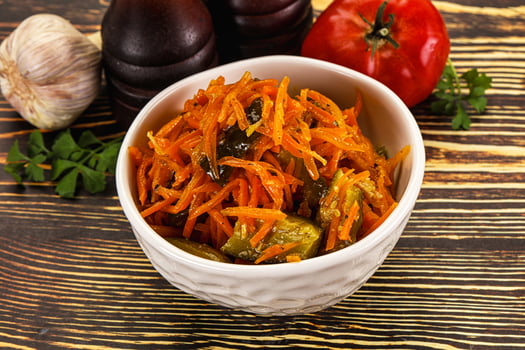 Salad with korean carrot and cucumber photo