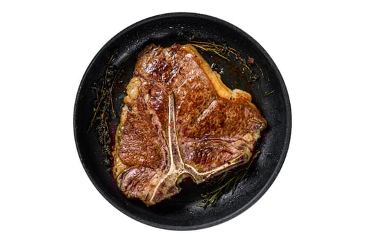 BBQ Grilled t-bone beef meat Steak with herbs on a plate. Isolated on white background. photo