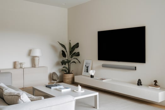 Modern minimalist living room interior with large television and beige sofa photo