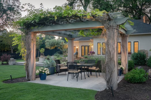 Elegant pergola providing shade for outdoor dining in luxurious backyard photo