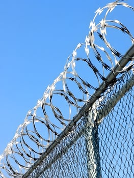 Barbed wire fence for security prison imprisonment safety and protective photo