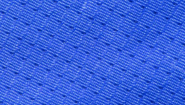 Vibrant blue textile fabric close up with detailed pattern and texture. photo