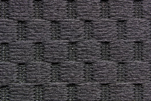Detailed close up of grey textured knitted fabric with abstract pattern. photo