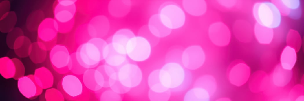 Vibrant pink bokeh lights create a lively atmosphere for celebrations and artistic displays at night events photo