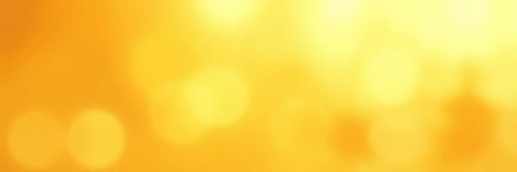 Vibrant golden background shining with warm light and soft bokeh effects during a summer evening photo