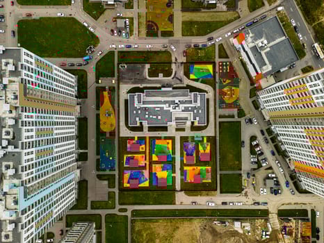 A Stunning Aerial View Showcasing Colorful Urban Playgrounds and Diverse Buildings in the City photo