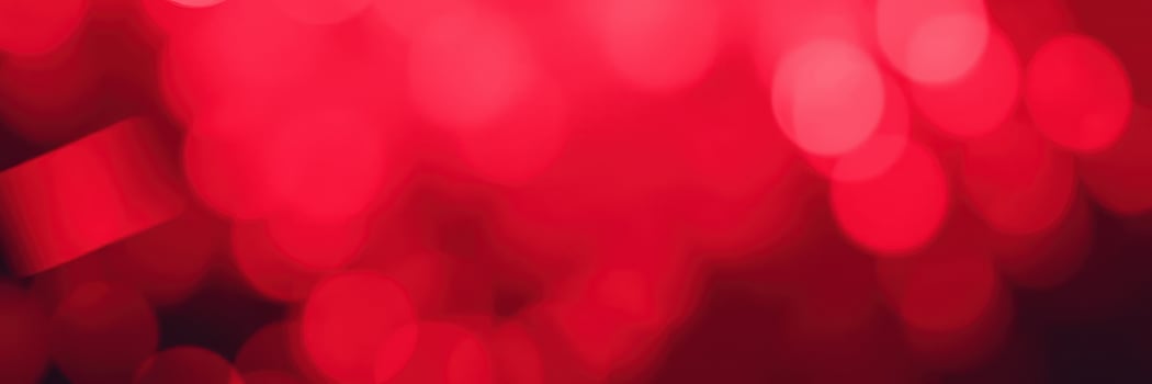 Colorful abstract background with varying shades of red and light bokeh effects during a festive evening event in a vibrant city atmosphere photo