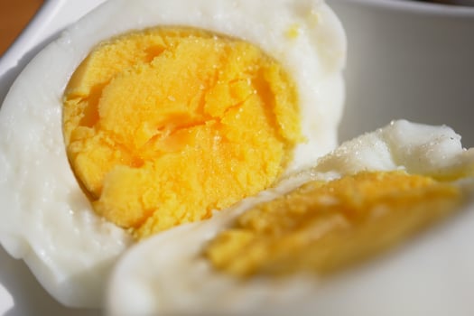 An UpClose Image of SoftBoiled Eggs Beautifully Sliced in Half photo