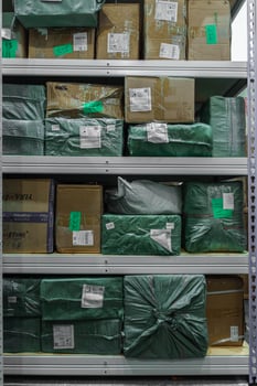 Shelves Filled With Packed Media Stock in a Spacious Warehouse Ready for Distribution photo
