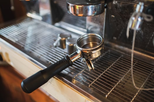 Grinder handle on coffee maker on counter photo