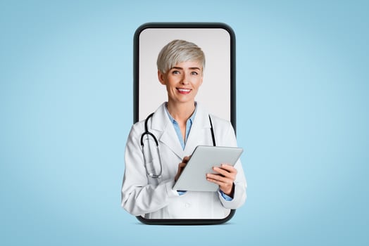 Woman doctor fills out medical history and writes out prescription on tablet, isolated on light background, studio shot photo