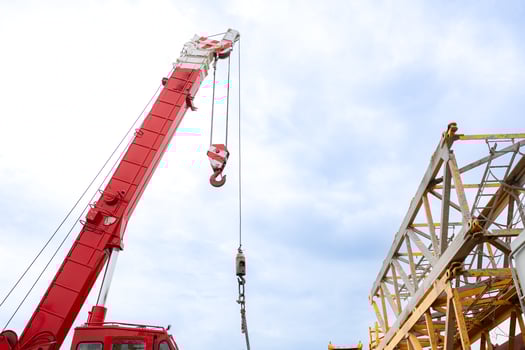 Mobile crane in at construction site with the sky in the background photo