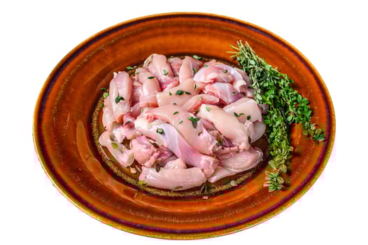 Cut Raw Chicken breast fillet on a plate. Isolated on white background, top view. photo
