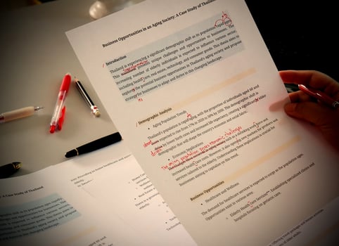 English proofreading paper in office photo
