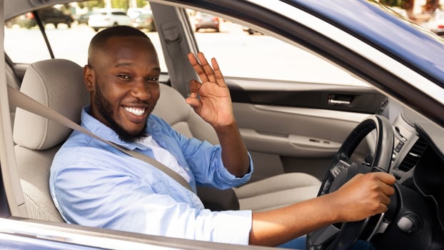 Great Perfect Car. Happy African American Male Showing Okay Sign Gesture, Sitting In New Automobile Buying Modern Vehicle In Dealership Store, Enjoying Vacation, Looking At Camera Through Open Window photo
