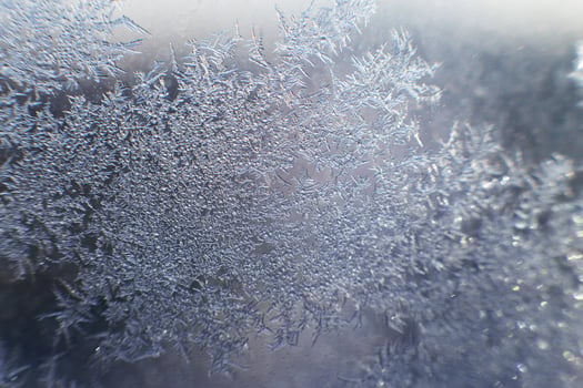 snow pattern on the glass from frost photo