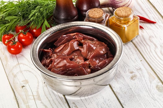 Raw chicken liver uncooked in the bowl photo
