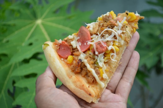 Delicious pizza with topping sausages, cheese, and corn, delicious meal to eat photo