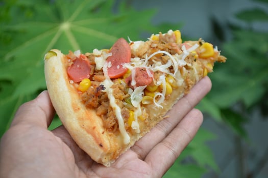 Delicious pizza with topping sausages, cheese, and corn, delicious meal to eat photo