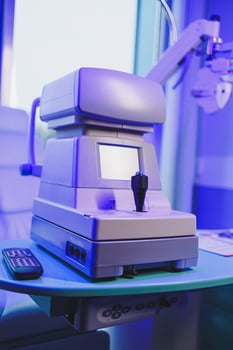 A modern microscope for vision testing in a light room. Microscope for vision correction. photo