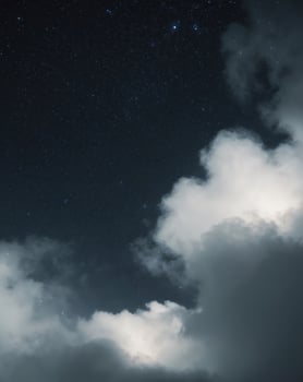 beautiful starry night sky with large clouds photo
