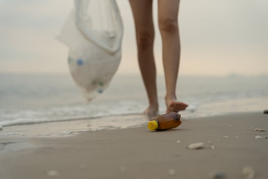 Save water. Volunteer pick up trash garbage at the beach and plastic bottles are difficult decompose prevent harm aquatic life. Earth, Environment, Greening planet, reduce global warming, Save worl photo