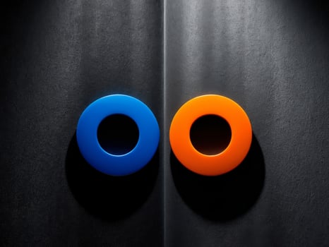 A blue and orange circle is on a black background. photo