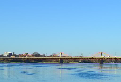 Urban landscape with bridge, modern buildings and blue sky in october. photo