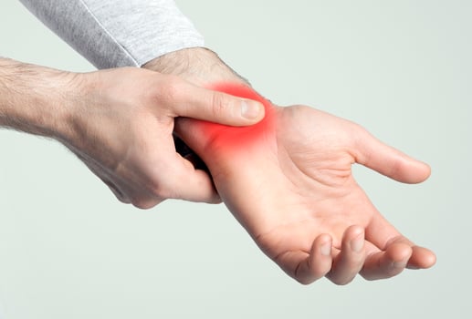 Wrist pain concept. Sore spot highlighted in red, empty space photo