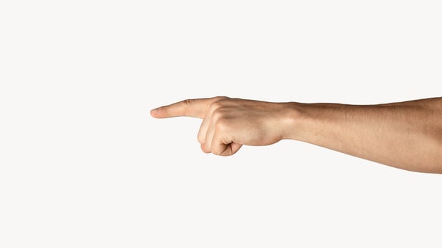 Unrecognizable young an pointing at something on light background, closeup of hand. Panorama photo