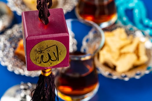 Muslim amulet of bordeux color on rope photo