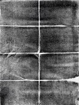 Grunge-style black and white folded paper texture with a distressed, rough appearance, perfect for backgrounds. photo
