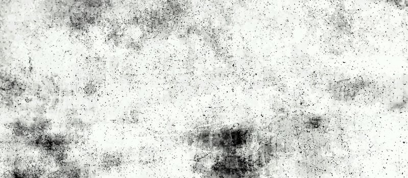 Light grunge texture with speckled noise and smudged patterns in black and white, ideal for backgrounds or overlays. photo