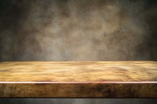 A textured wooden table against a blurred background. photo