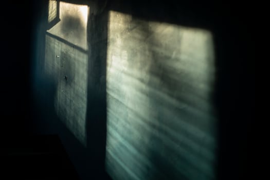 The light in the building. The rays of the sun on the wall. Window in the entrance. Interior of the building. photo