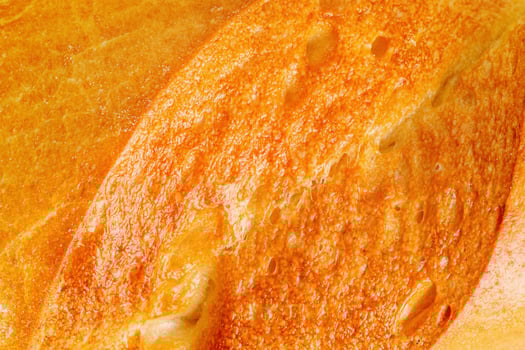 Baguette macro photo as background. Bread