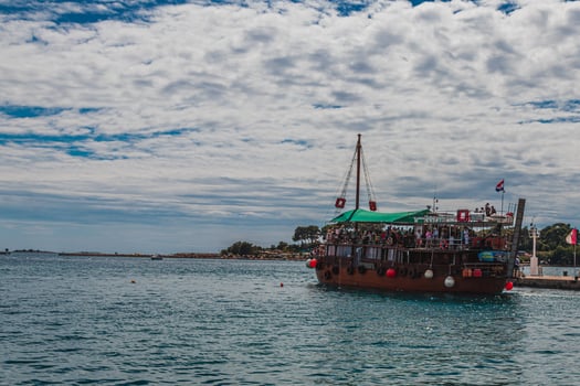 03.07.24 Porec Croatia Tourist ship sails with people on a tour photo